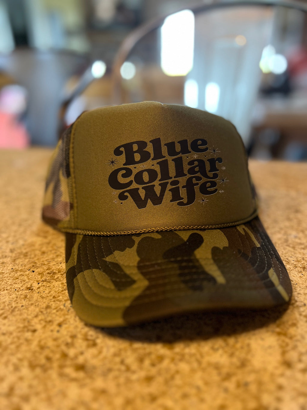 Blue Collar Wife DTF printed on Camo and Olive Foam Trucker Hat